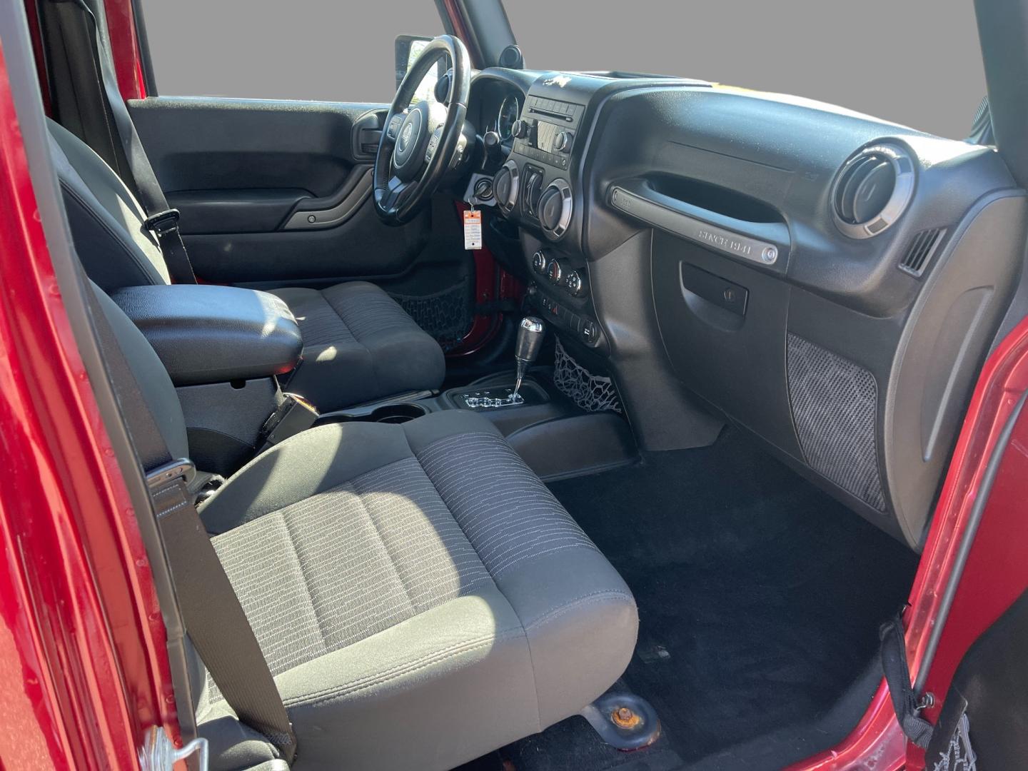 2012 Red /Black Jeep Wrangler Unlimited Sport 4WD (1C4BJWDG3CL) with an 3.6L V6 DOHC 24V engine, 5-Speed Automatic transmission, located at 547 E. Main St., Orwell, OH, 44076, (440) 437-5893, 41.535435, -80.847855 - This 2012 Jeep Wrangler Unlimited Sport with 4WD features a robust 3.6-liter Pentastar V6 engine paired with a 5-speed automatic transmission. It is equipped with a Dana 44 rear axle and a Dana 30 front axle, ensuring durable and reliable off-road capabilities. The model comes with a hardtop convert - Photo#38